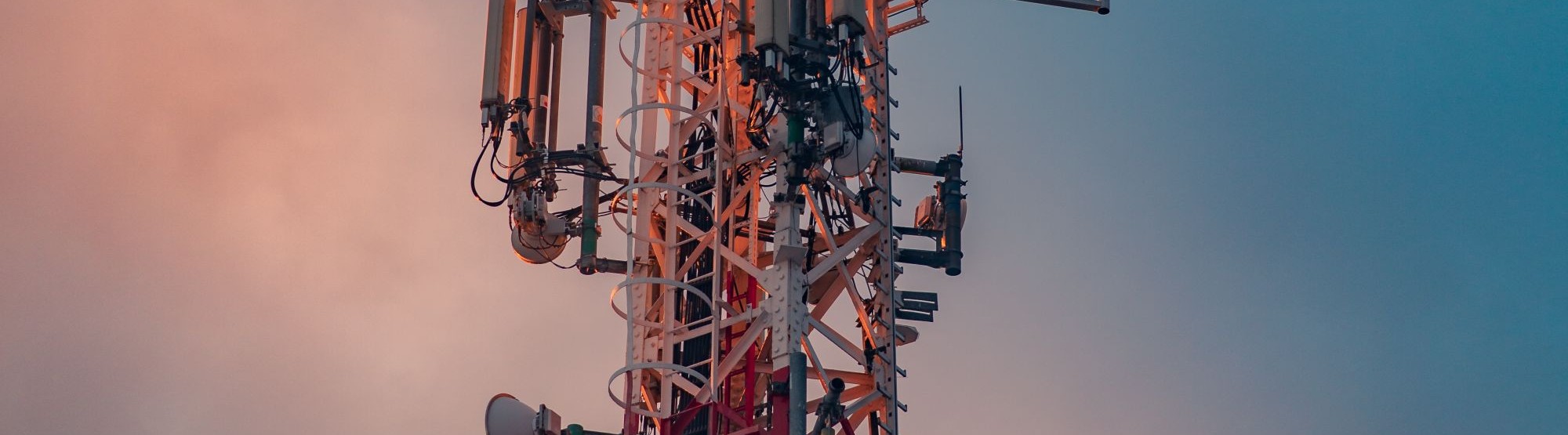 Close-up of telecom tower antenna and microwave equipment
